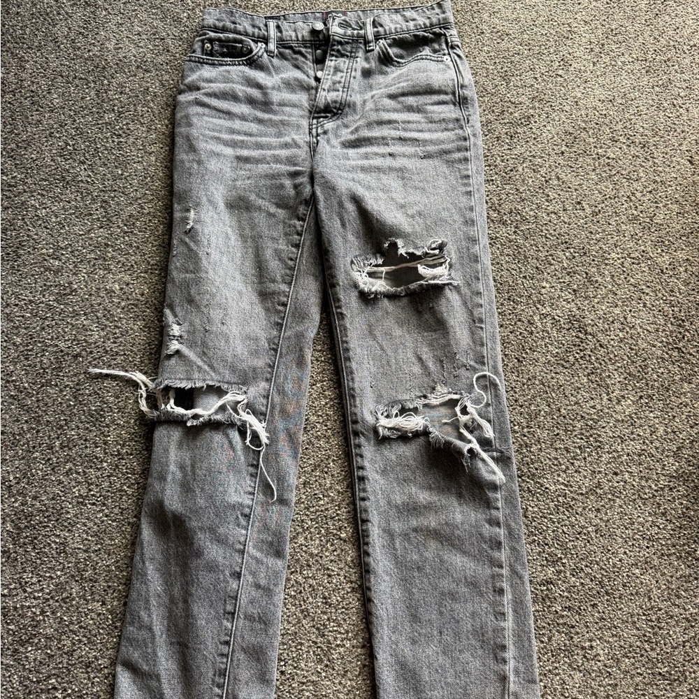 BDG faded black slim straight jeans with holes.